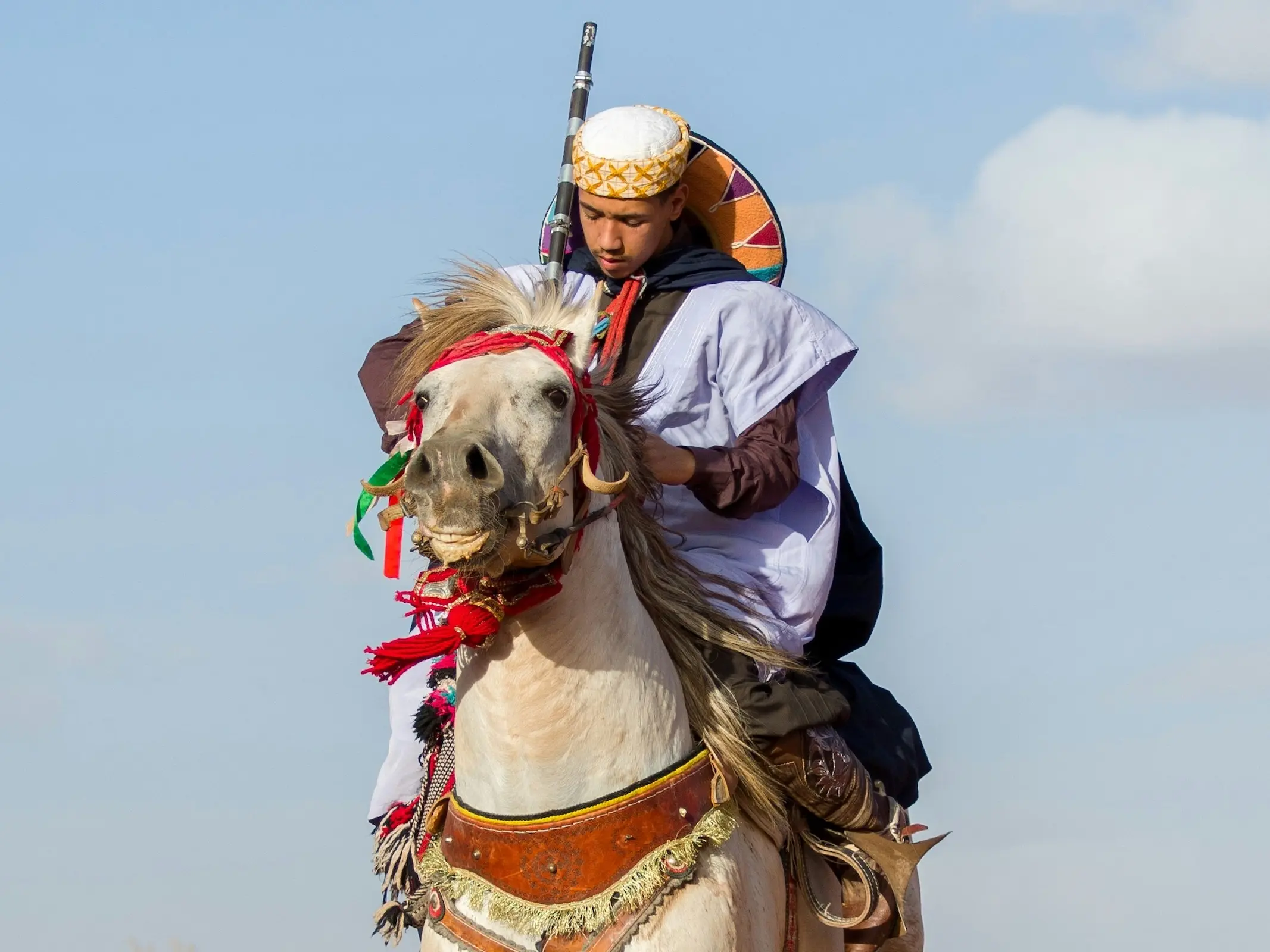 Man in traditional dress on a Barb horse