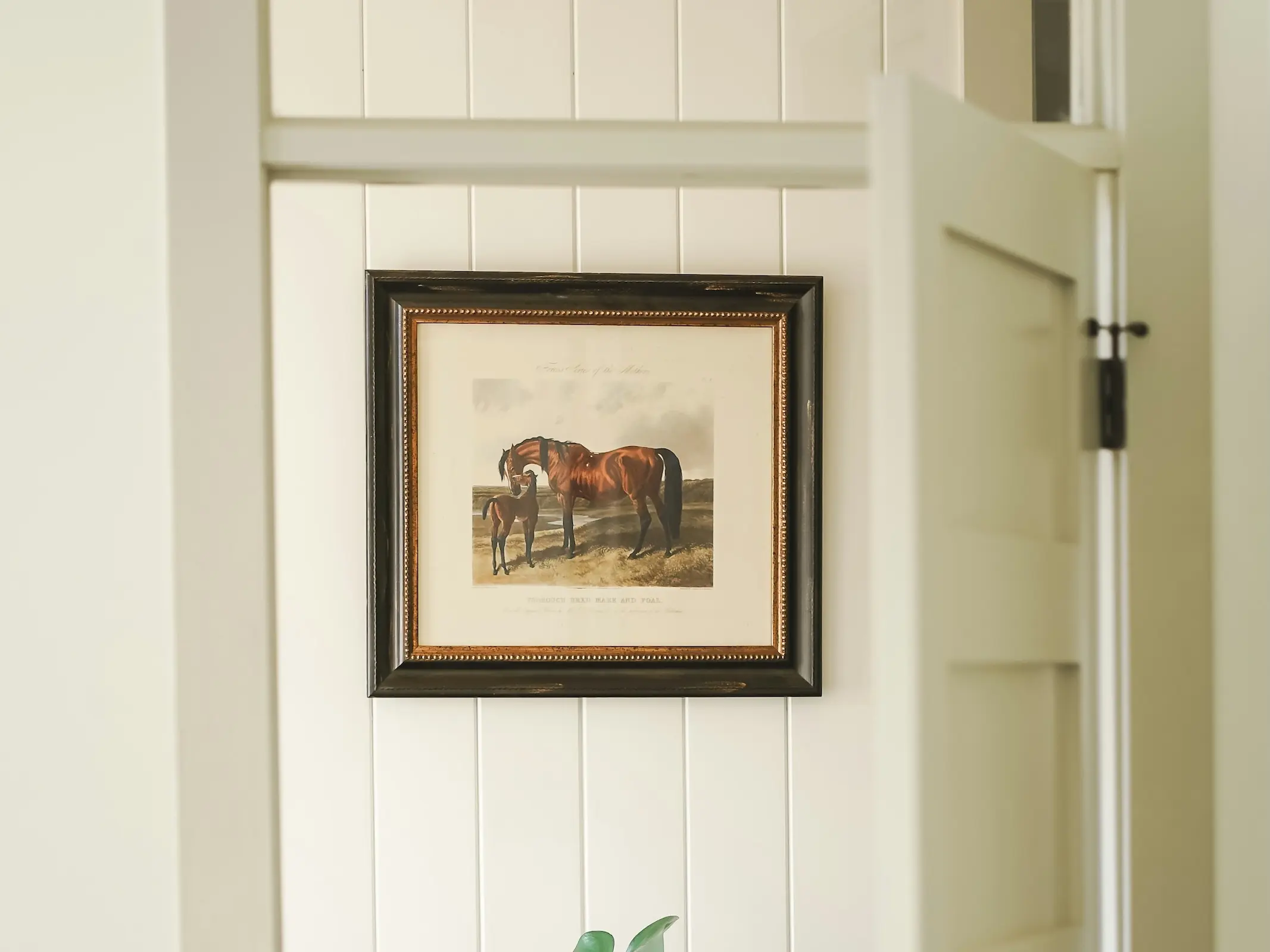 painting of a bay horse hanging on a wall