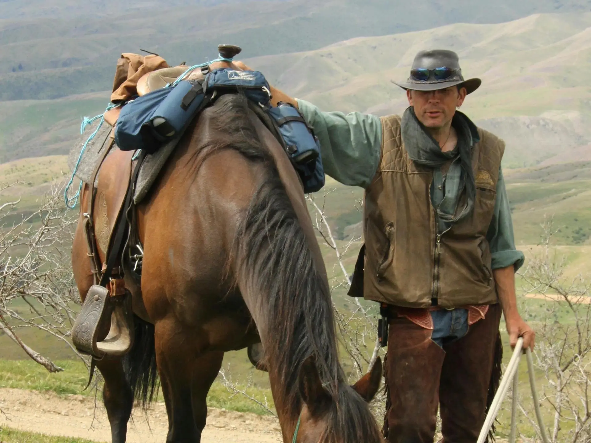 Man standing with a horse