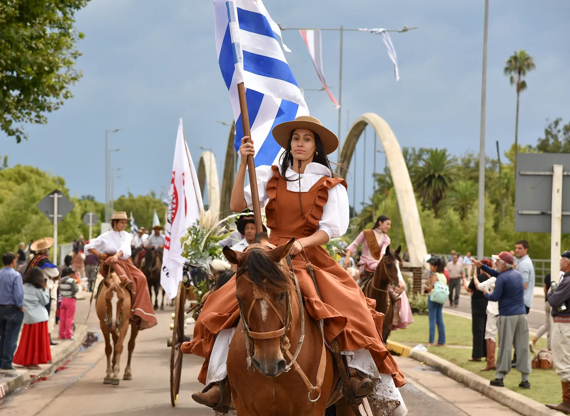 woman riding a horse in a parade