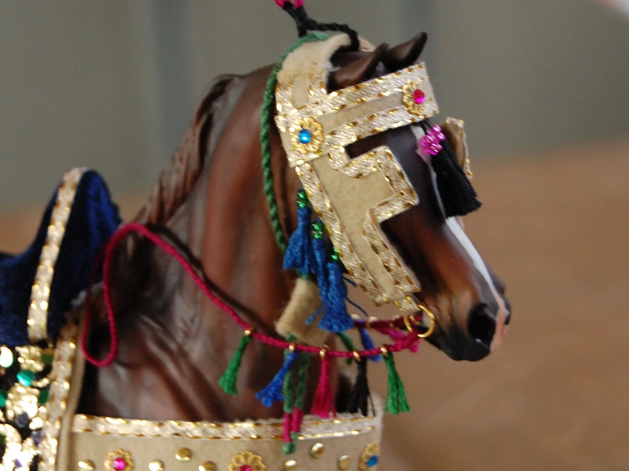 Model horse wearing miniature handmade bridle