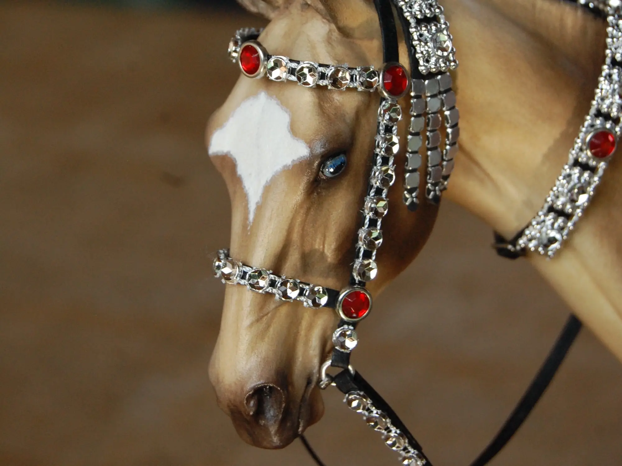 Model horse wearing miniature handmade bridle