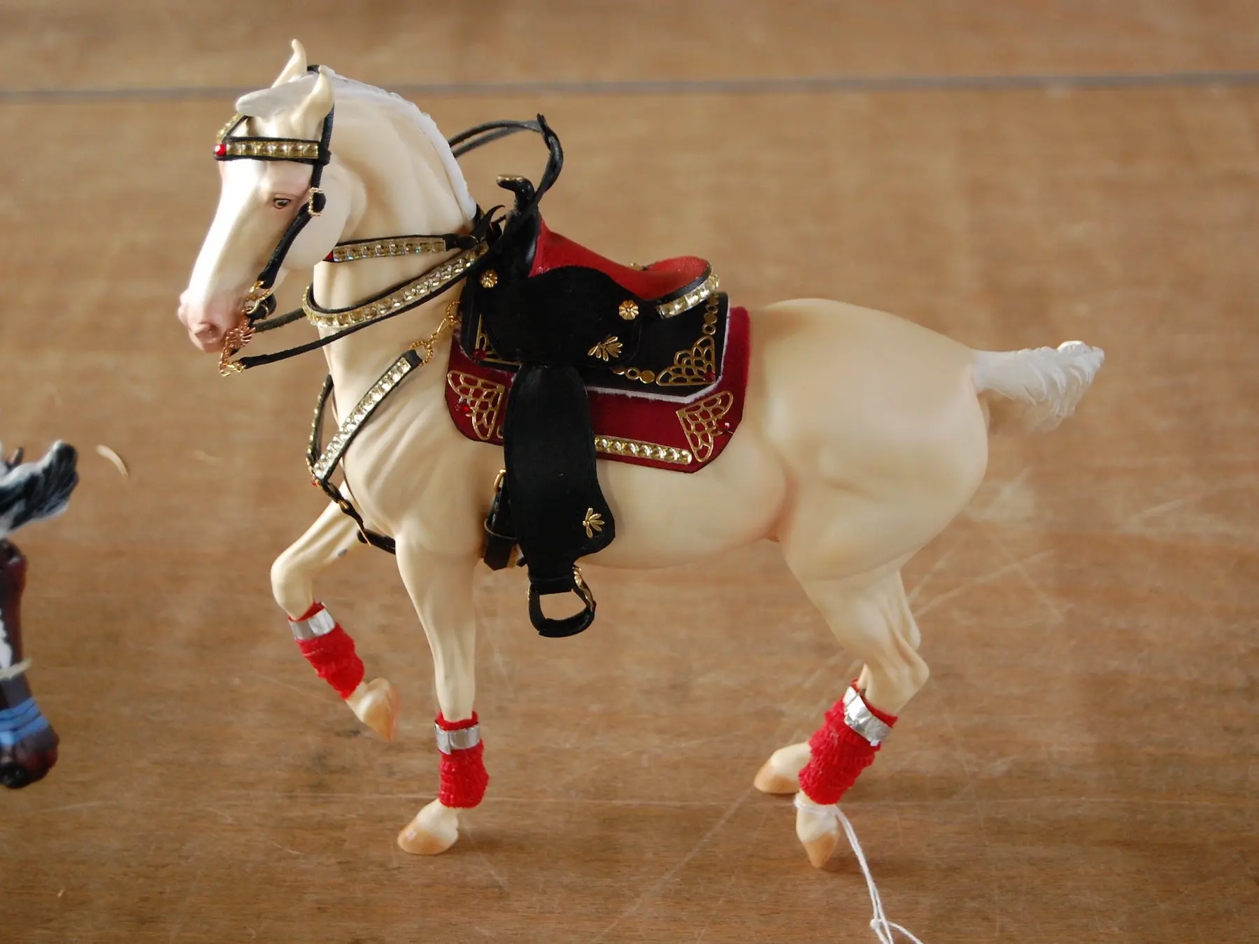 Model horse wearing miniature handmade tack