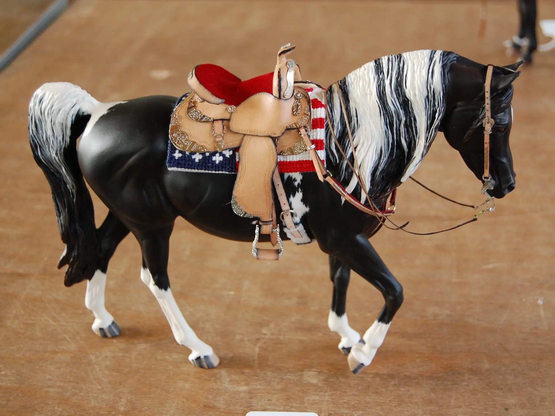 Model horse wearing miniature handmade tack