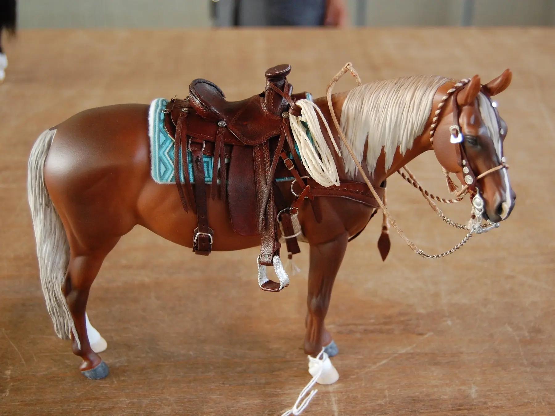 Model horse wearing miniature handmade tack