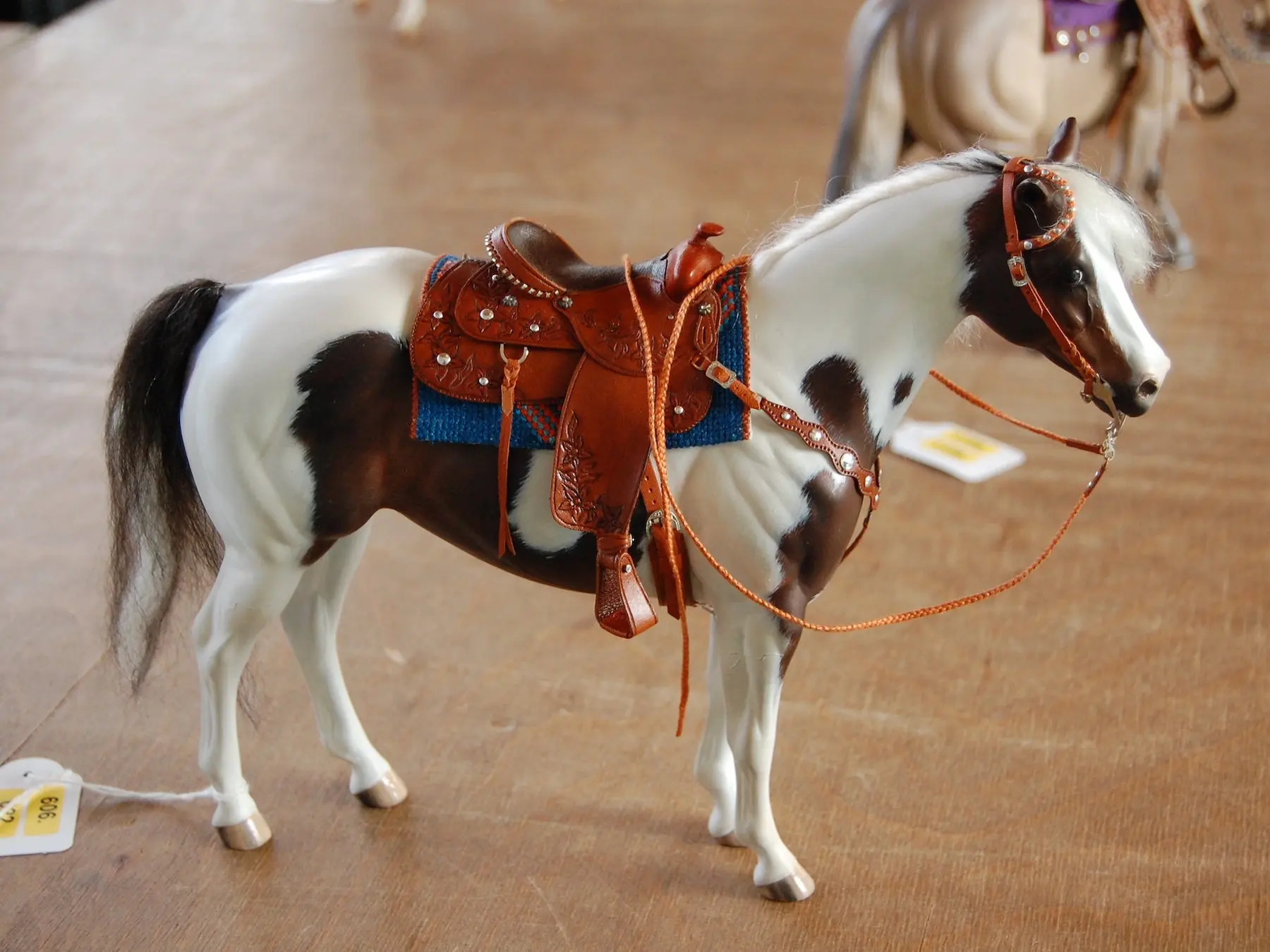 Model horse wearing miniature handmade tack