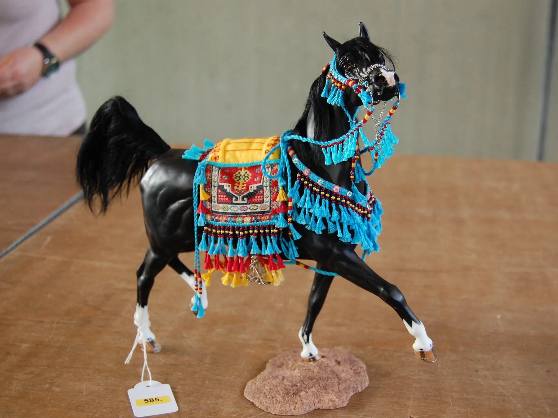 Model horse wearing miniature handmade tack