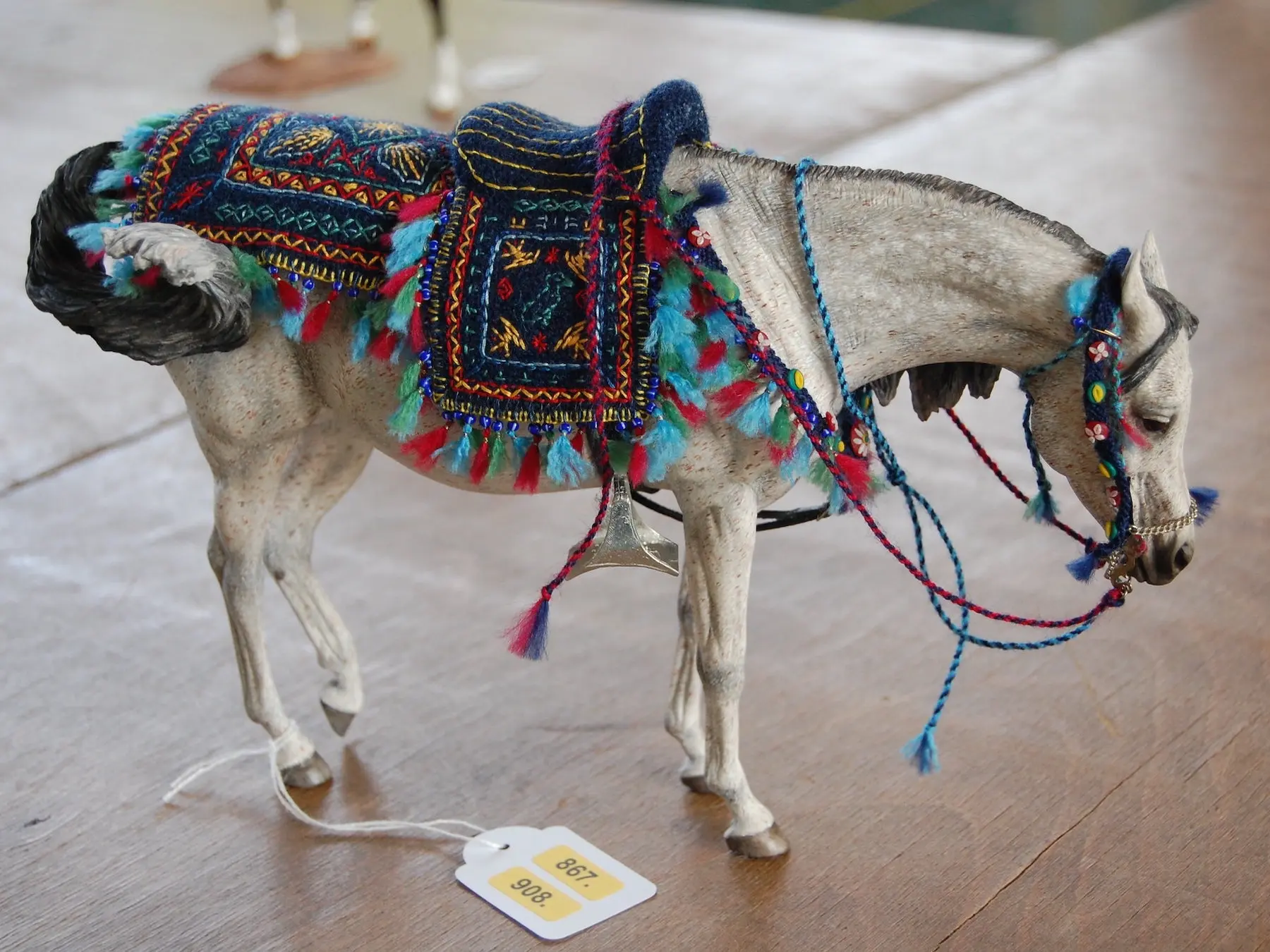 Model horse wearing miniature handmade tack