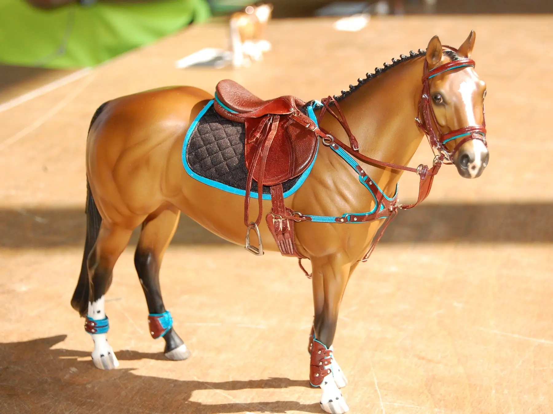 Model horse wearing miniature handmade tack