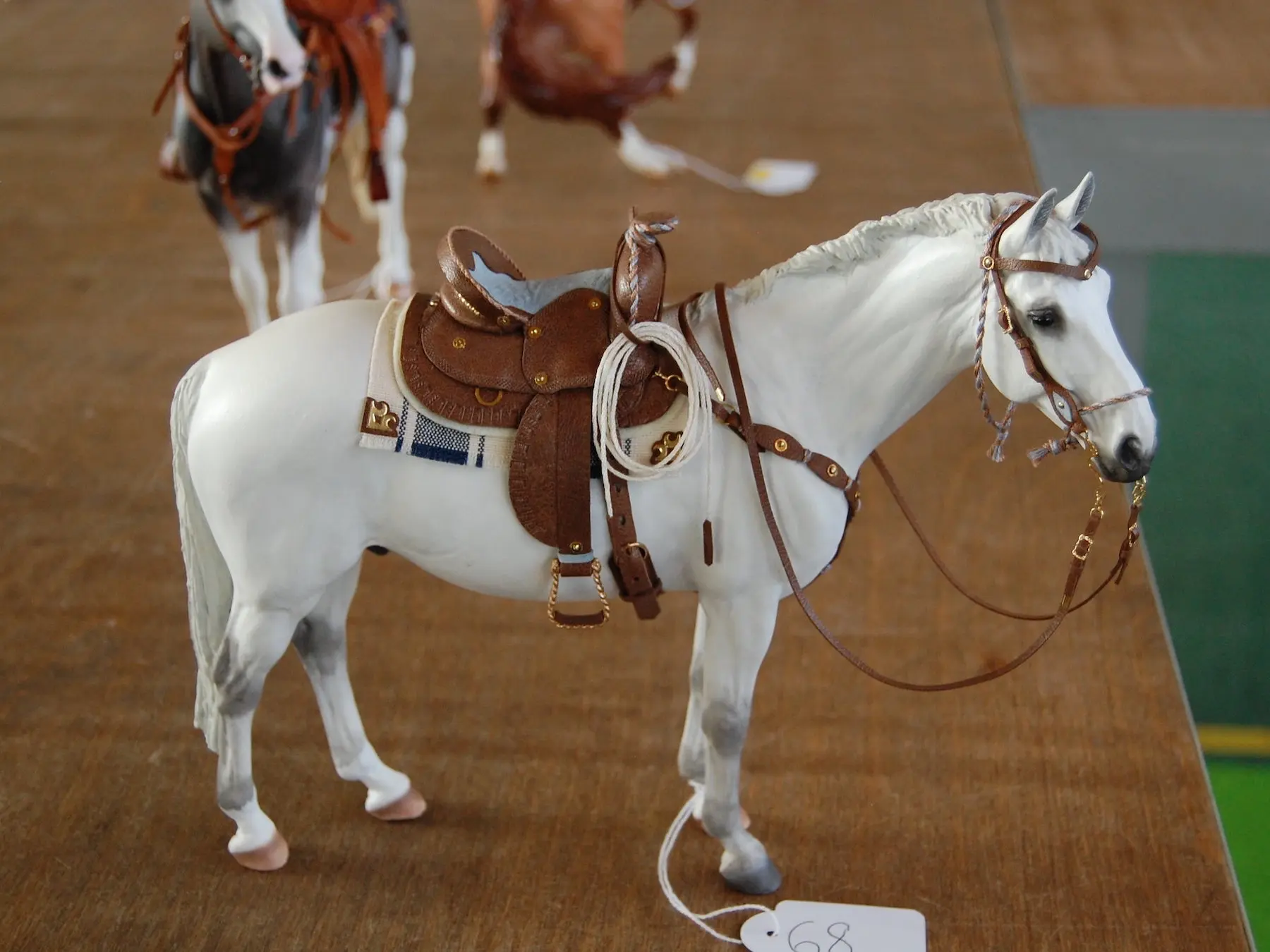 Model horse wearing miniature handmade tack