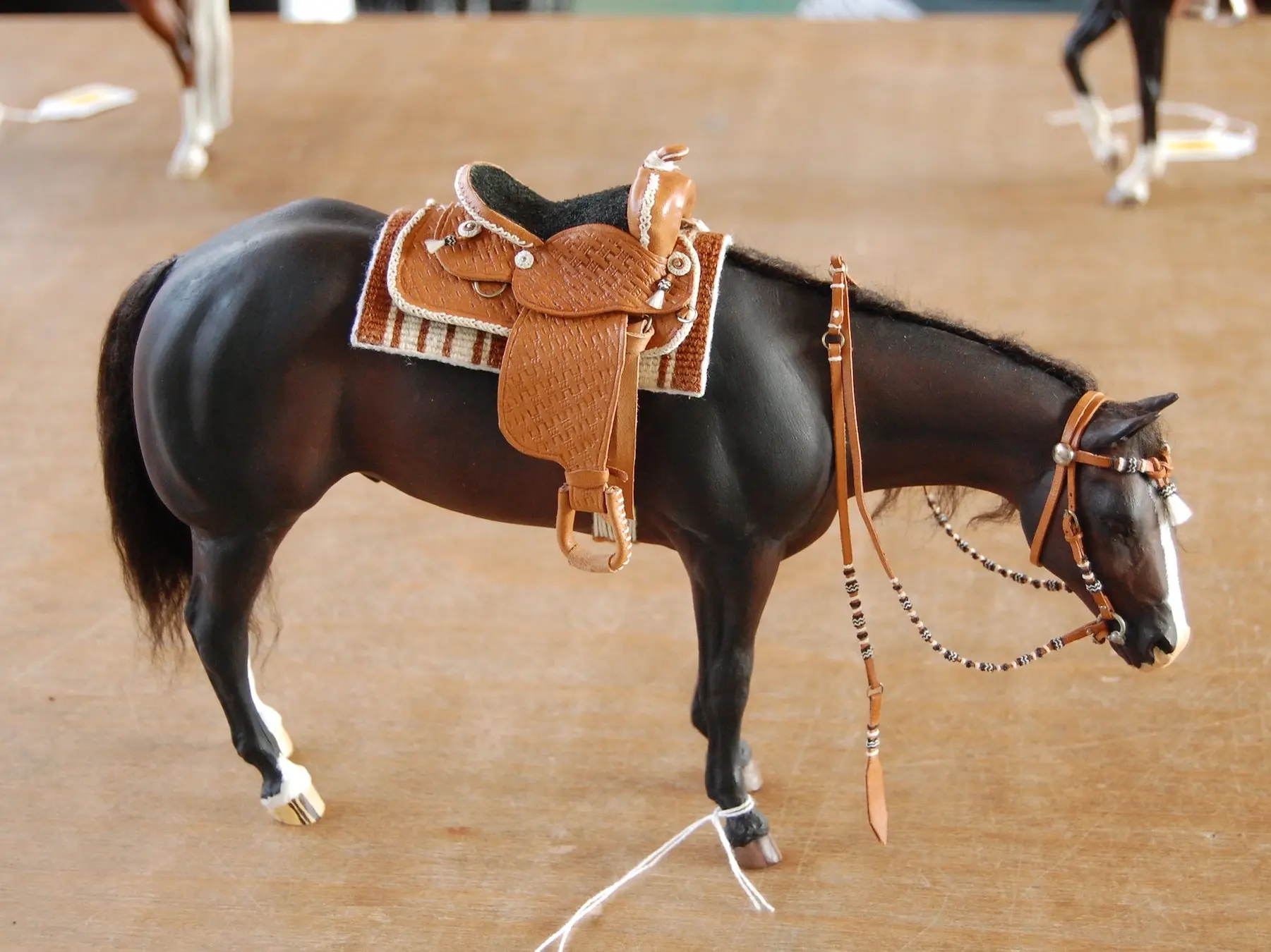 Model horse wearing miniature handmade tack