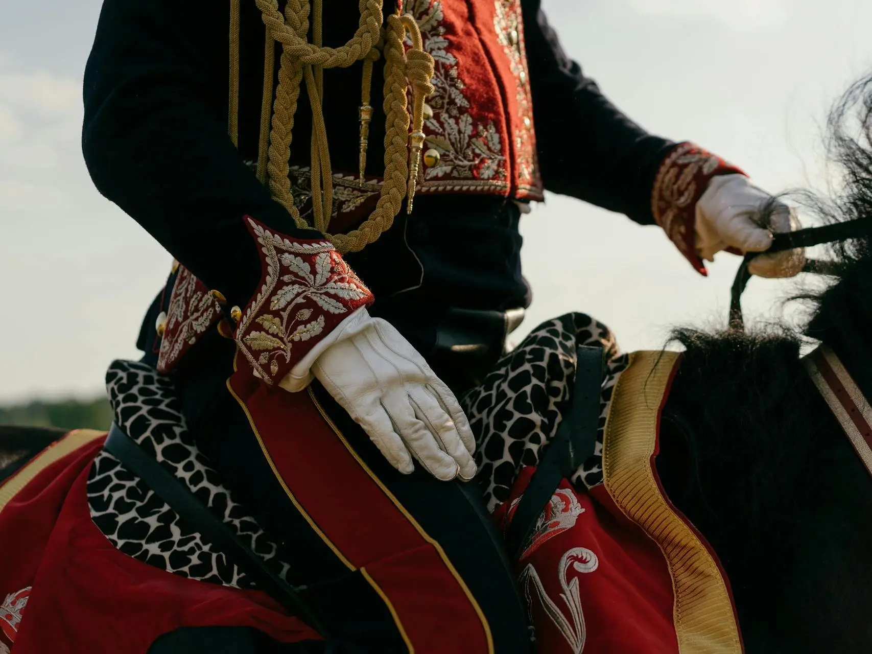 Close up of a person in military uniform on a horse