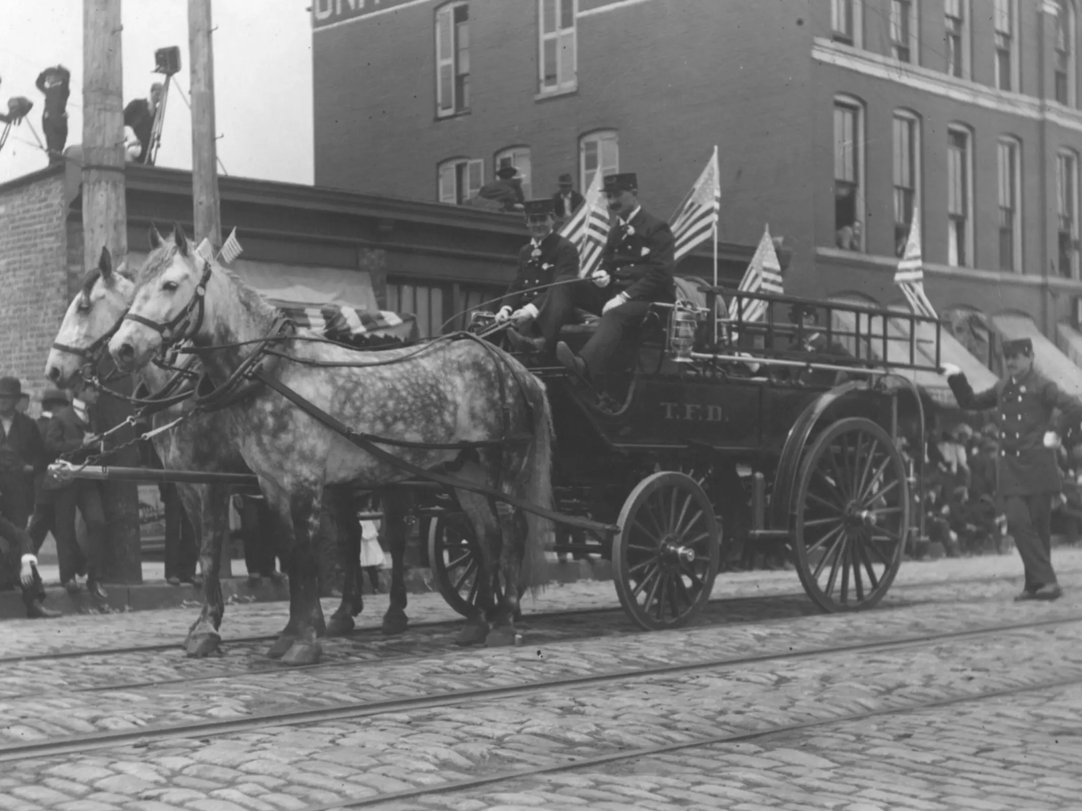 Horse team pulling a fire wagon