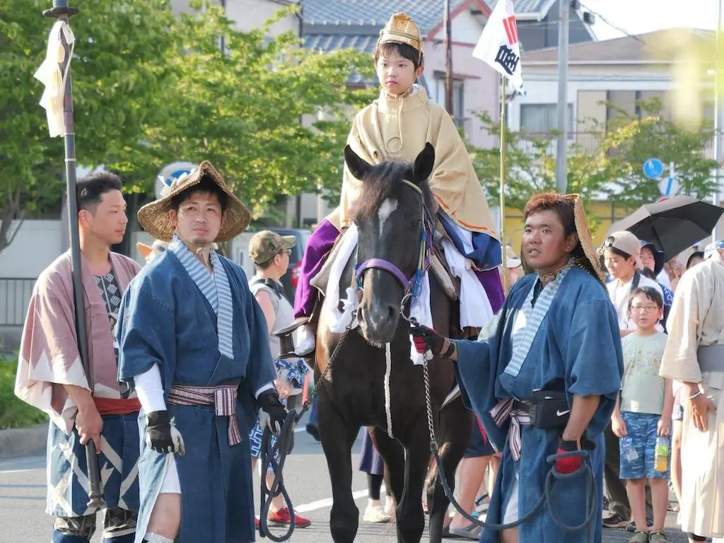 People with a horse in a parade in Japan